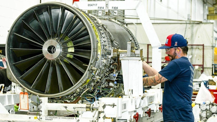 Jet Engine Mechanic testing engine parts.