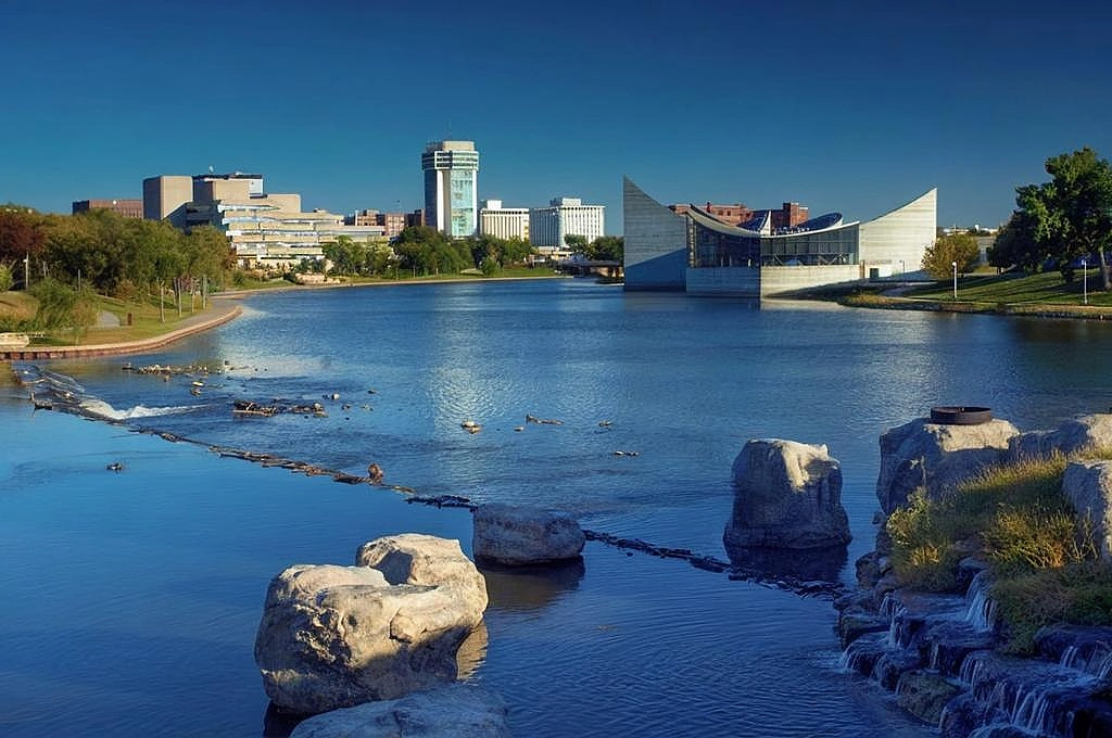 Skyline of Wichita, KS off the water's edge.